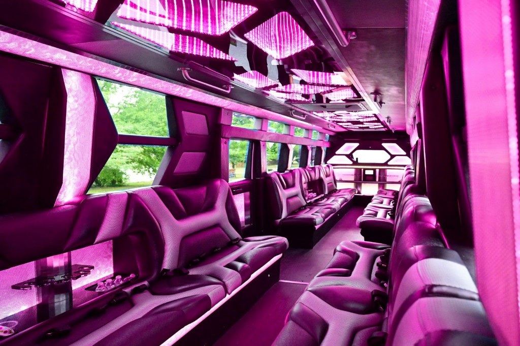 Luxury party bus interior with pink LED lighting